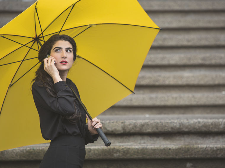 woman under umbrella in London provided by Addison Lee